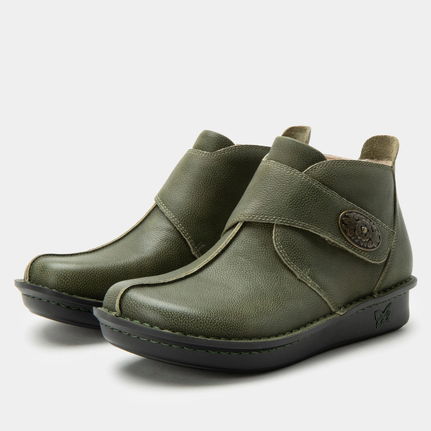 Alegria Caiti women’s ankle boots in avocado green leather with decorative buckle, hand stitching, padded collar, and slip-resistant mini outsole.