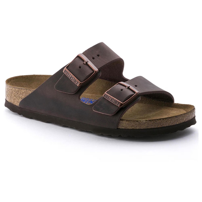Birkenstock Arizona sandal in oiled brown leather with two adjustable straps, copper buckles, contoured cork soft footbed, and a lightweight black EVA sole.