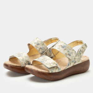 Pair of Alegria Bailee sandals in Conjure colorway with printed leather uppers, three adjustable straps, a soft microsuede footbed, and a rocker-style outsole for a sleek and comfortable fit.