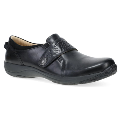 Women’s Dansko Sallie in black leather featuring adjustable strap, cushioned EVA footbed, and slip-resistant outsole for stable comfort.