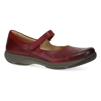 Women’s Dansko Stacy red leather Mary Jane featuring adjustable strap, cushioned EVA arch support, and slip-resistant outsole for stability.