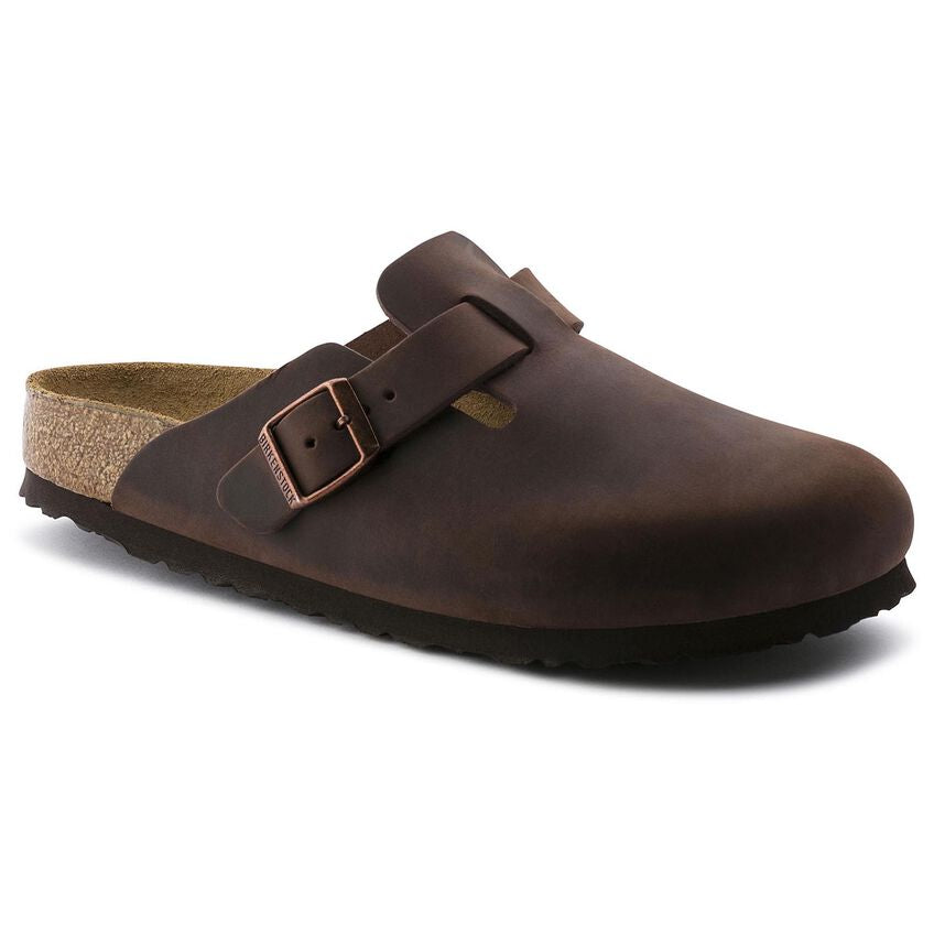 Side view of a Boston clog in Habana oiled leather, featuring an adjustable strap with a copper buckle, a cork-latex footbed, and a durable black outsole.