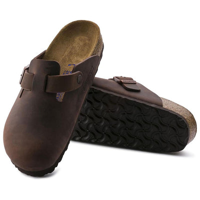 Side view of a BIRKENSTOCK Boston clog in Habana oiled leather, featuring an adjustable strap with a copper buckle, a cork-latex footbed, and a durable black outsole.