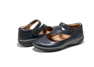 Women’s Hälsa Ava maryjane shoes in navy leather with stylish strap, supportive Equilibrium+ footbed, antimicrobial lining, and shock-absorbing lightweight outsole.