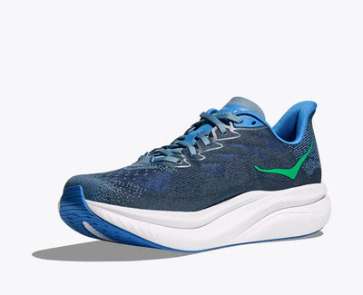 Side view of a blue HOKA Mach 6 running shoe with breathable mesh uppers, a bright blue and green HOKA logo on the side, and a thick white cushioned sole with blue detailing for enhanced performance and comfort.