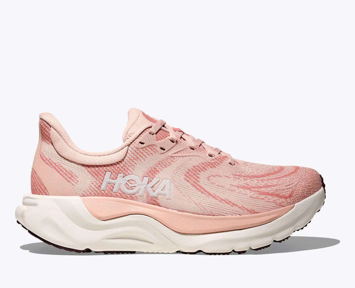 Women’s HOKA Arahi 8 in blush/rose latte, a sleek stability shoe with H-Frame™ technology, breathable jacquard mesh, and cushioned EVA midsole for smooth everyday running.