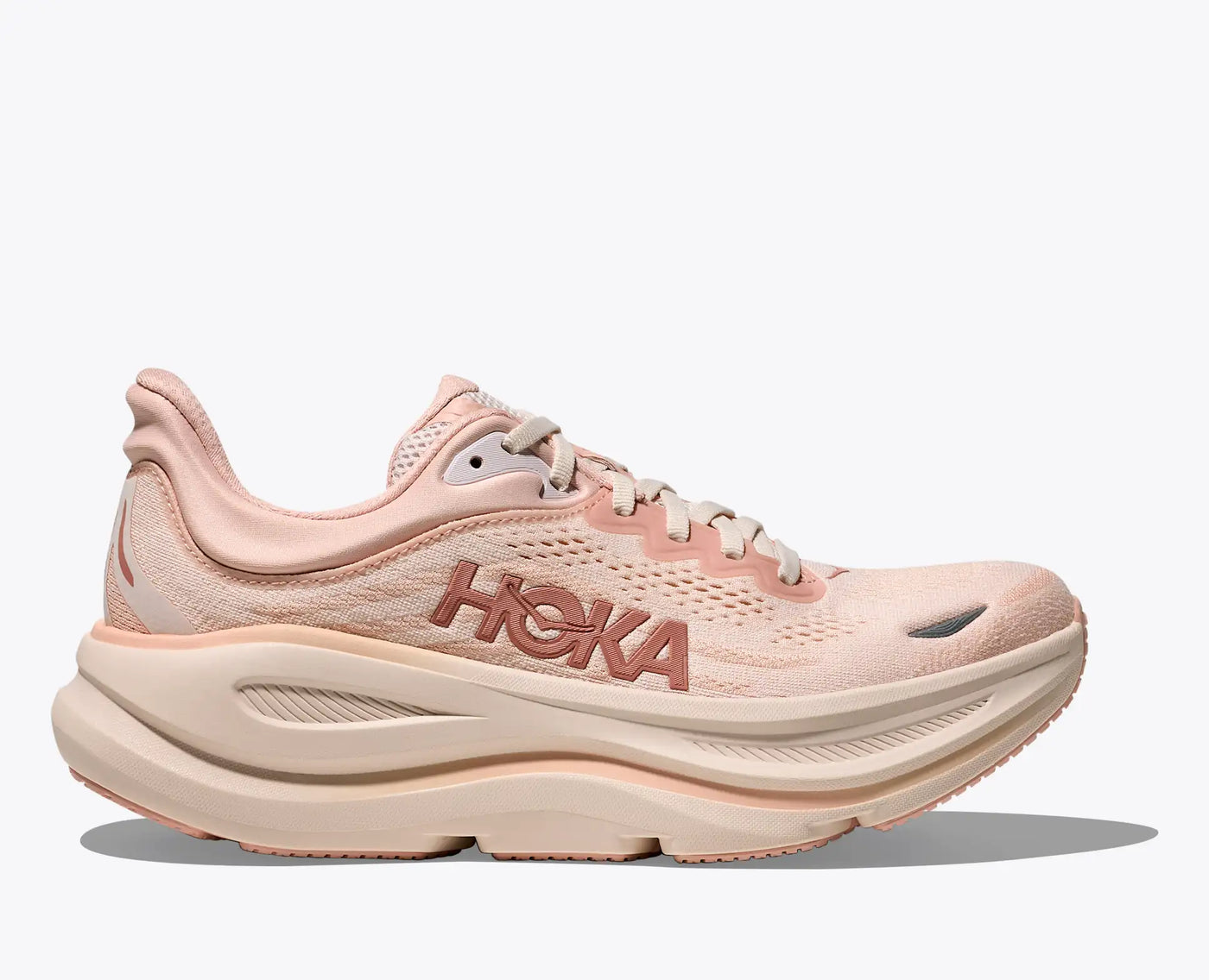 Women’s HOKA Bondi 9 running shoes in Rose Latte / Rose Cream featuring 3D molded collar, breathable engineered mesh, and ultra-cushioned EVA midsole for maximum comfort.