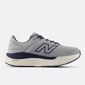 New Balance men’s grey and navy sneaker with Fresh Foam X midsole, ROLLBAR stability system, and breathable engineered knit upper for everyday comfort and support.
