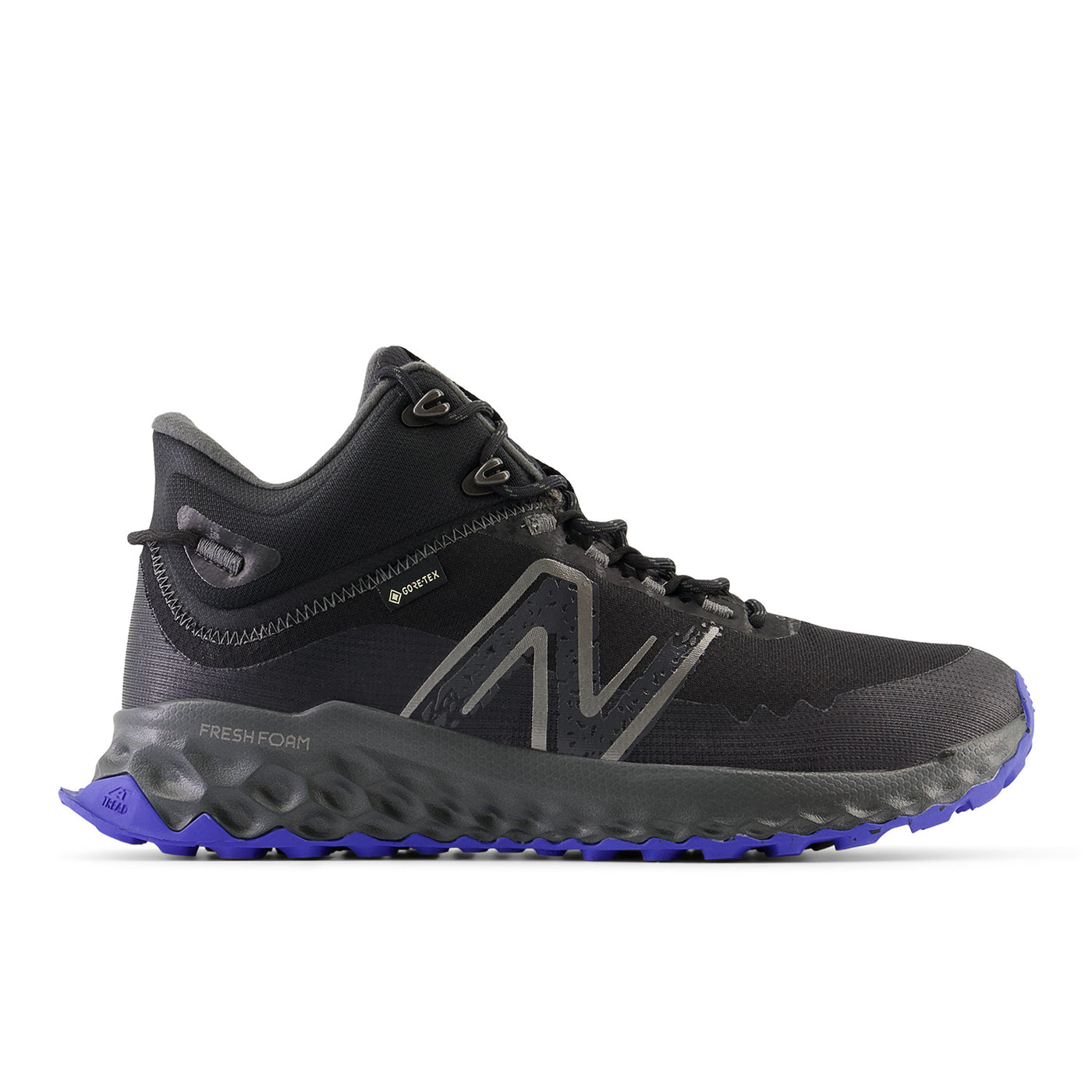 Black and gray New Balance Fresh Foam Garoé MID trail shoe with GORE-TEX lining, bold N logo, and purple AT Tread outsole for comfort, grip, and durability on all terrains.