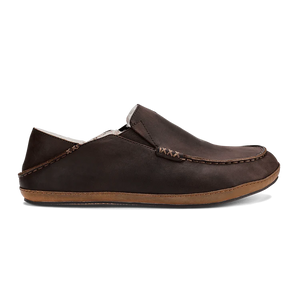 OluKai Men’s Moloā Slipper in dark wood nubuck leather with soft shearling lining and moc-style stitching for premium year-round comfort.