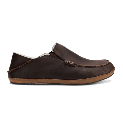 OluKai Men’s Moloā Slipper in dark wood nubuck leather with soft shearling lining and moc-style stitching for premium year-round comfort.