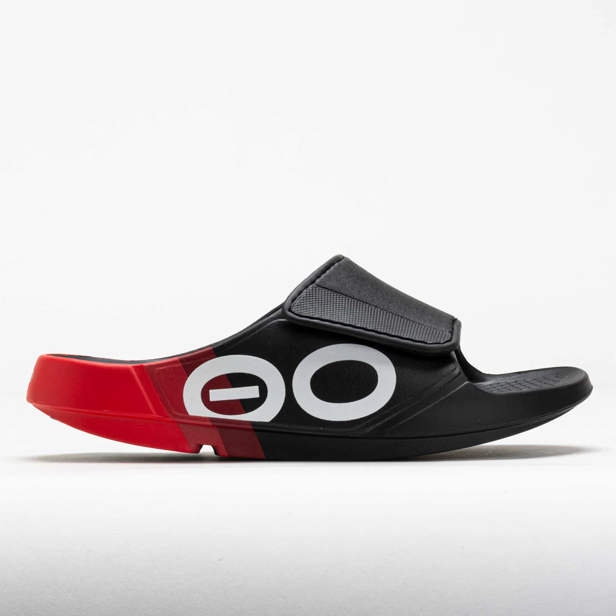 OOFOS OOahh Sport Flex Limited Edition slide in black and red with adjustable strap, featuring OOfoam™ cushioning for recovery and comfort.