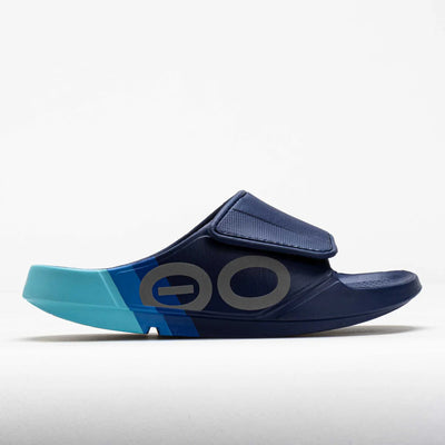 Men’s OOFOS OOahh Sport Flex Sky Rally slide in navy and teal, designed with adjustable strap and OOfoam™ technology for post-activity recovery.