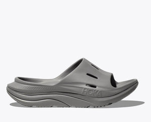 HOKA ORA Slide 3 in grey, featuring ventilated air flow channels, a dual-density sugarcane EVA midsole, and an injection-molded outsole for lightweight recovery and all-day comfort.