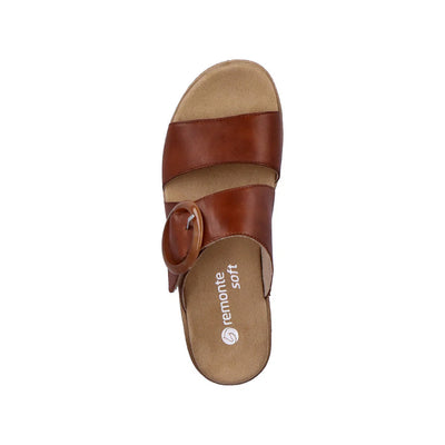 Top view of a mocha brown leather mule sandal with a large side buckle, soft removable footbed, and Remonte Soft branding on the insole.
