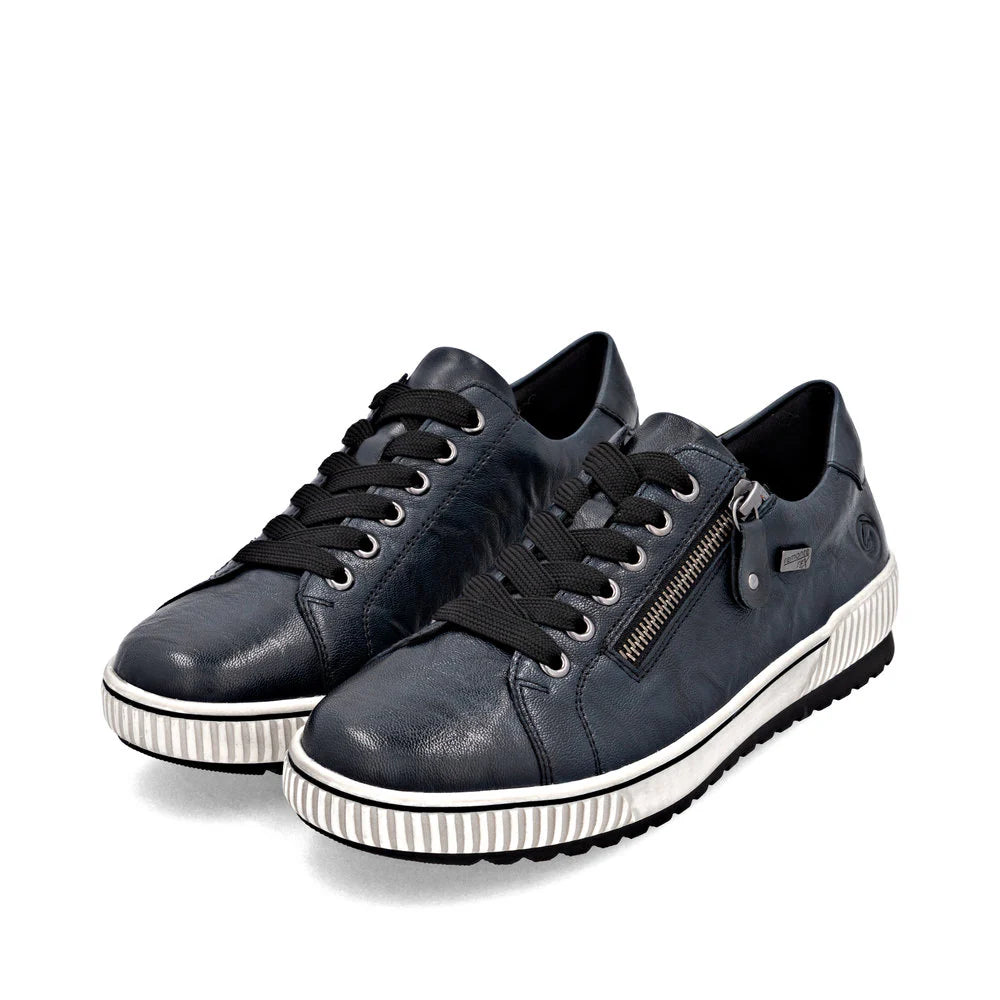Remonte Women’s blue leather lace-up sneakers with side zipper, black laces, and white ridged sole for cushioned, water-resistant comfort.