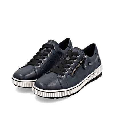 Remonte Women’s blue leather lace-up sneakers with side zipper, black laces, and white ridged sole for cushioned, water-resistant comfort.