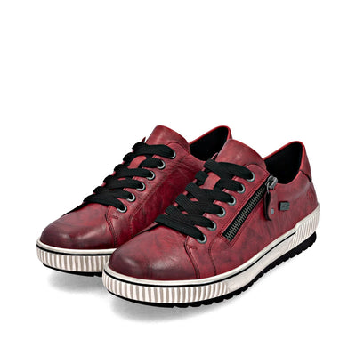 Remonte Women’s Red leather sneakers with black laces, side zipper, removable insole, and water-repellent design for all-day comfort and style.