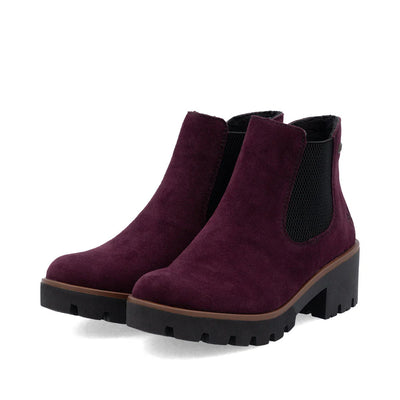 Rieker Women’s Burgundy suede Chelsea boots with chunky lug sole, slip-on elastic panels, and block heel for stylish all-day comfort.