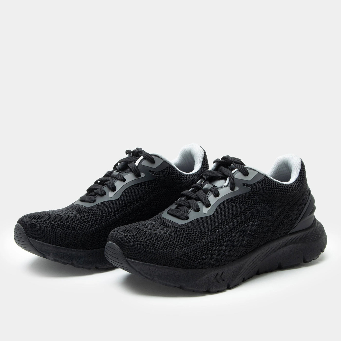 Pair of black mesh sneakers with gray accents, lace-up closure, padded collar, removable footbed, and ultra-light ReBounce™ outsole with rubber bottom for comfort, support, and slip resistance.