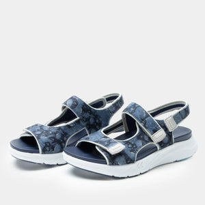 Pair of sporty open-toe sandals in a Midnight Oddity colorway with a blue and black patterned textile upper, three adjustable hook-and-loop straps, and a cushioned dual-density outsole for comfort.