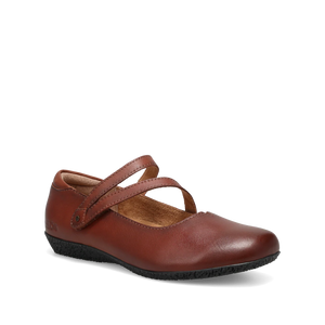 Women’s Taos Banter cognac flats with luxe leather upper, secure V-strap style, cushioned microfiber lining, and orthotic-friendly removable footbed.
