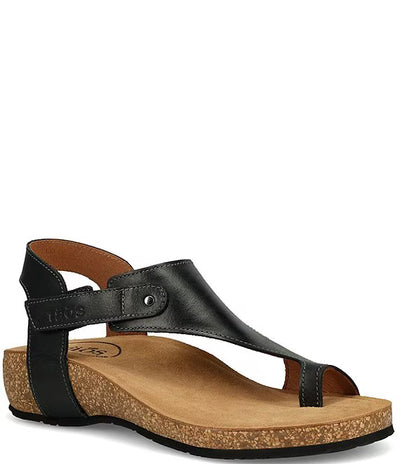 Black Taos Fame leather sandals for women featuring hook-and-loop strap, suede lining, cork midsole, arch support, and durable rubber outsole.