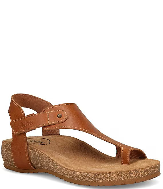 Women’s Taos Fame sandals in TAN leather with toe loop design, adjustable ankle strap, cushioned arch support, cork midsole, and flexible rubber outsole.