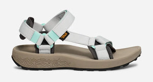 Teva Hydratrek sandal in white and mint with padded straps, grippy textured sole, and recycled materials, designed for water traction and outdoor adventures.