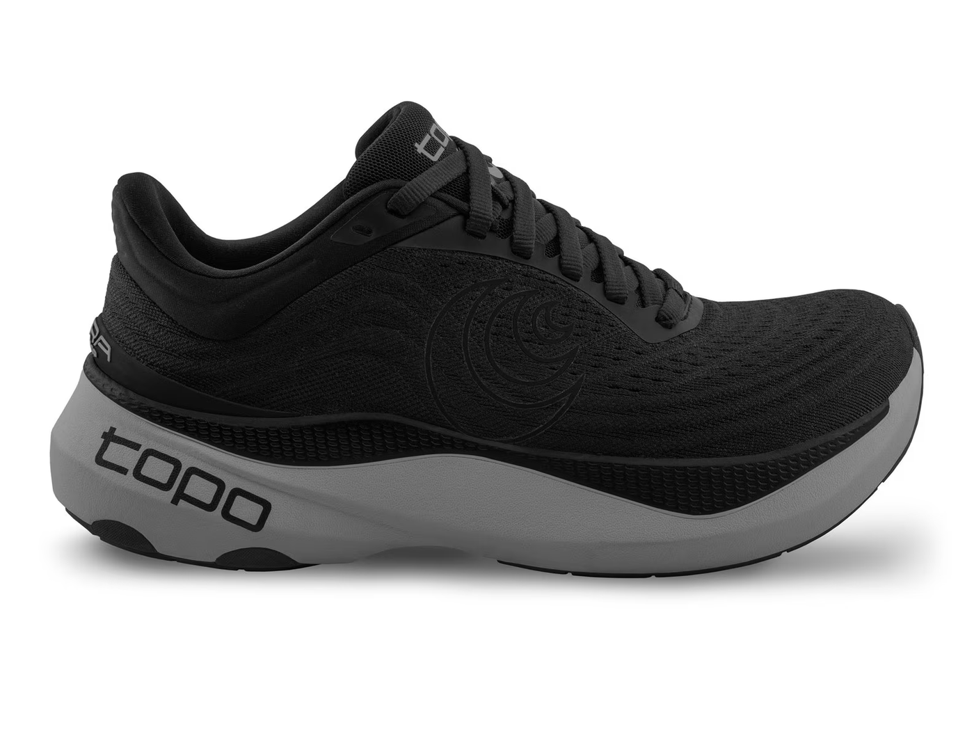 Side view of an all-black Topo running shoe with subtle tonal swirl logo on the side, topo branding on the gray sole, and a thick cushioned midsole for comfort and performance.