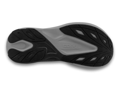 Side view of an all-black Topo running shoe with subtle tonal swirl logo on the side, topo branding on the gray sole, and a thick cushioned midsole for comfort and performance.