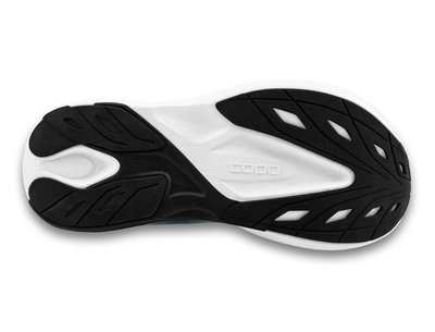 View of a light gray Topo running shoe with a gradient design fading into charcoal, featuring a black swirl logo on the side, 'topo' branding on the sole, and a thick white cushioned sole for comfort and performance.