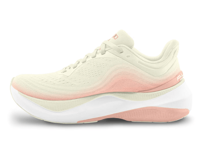 Side view of a cream-colored Topo running shoe with a soft pink gradient, featuring a pink swirl logo on the side, 'topo' branding on the cushioned sole, and pink accents for a light and elegant design.