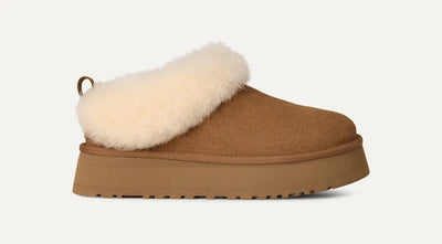 UGG Tazzelle platform clog in chestnut, plush sheepskin collar, suede upper, and springy sugarcane EVA outsole; indoor/outdoor.