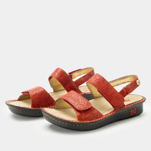 Pair of Alegria Verona sandals in Coralita colorway with laser-etched leather uppers, three adjustable straps, a mini-rocker outsole, and an ergonomically designed footbed for all-day comfort.
