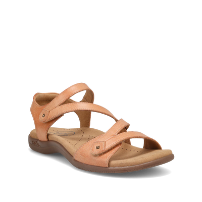 Angled view of a natural beige Taos sandal featuring adjustable straps, a cushioned footbed with perforations, and a supportive sole.