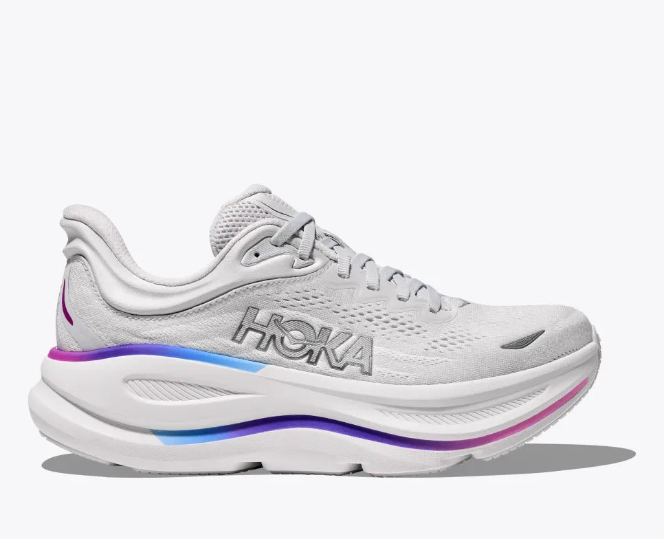 HOKA Bondi 9 running shoe in white with a gradient midsole featuring blue and purple hues, engineered mesh upper, super critical foam midsole, and Durabrasion rubber outsole for durability and comfort.