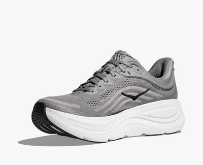 Side view of a gray HOKA running shoe with breathable mesh uppers, black HOKA logo on the side, and a thick white cushioned sole for comfort and support.