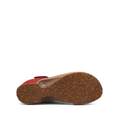 View of a pair of red Taos sandals featuring a slip-on design with a soft suede footbed and subtle stitching details.