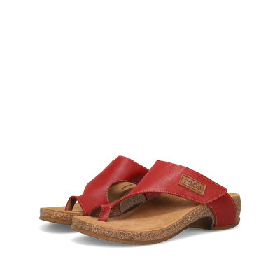 Side view of a pair of red Taos sandals featuring a slip-on design with a soft suede footbed and subtle stitching details.