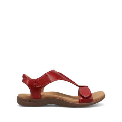 Side view of red Taos sandal featuring a T-strap design with adjustable straps and a cushioned footbed for comfort.