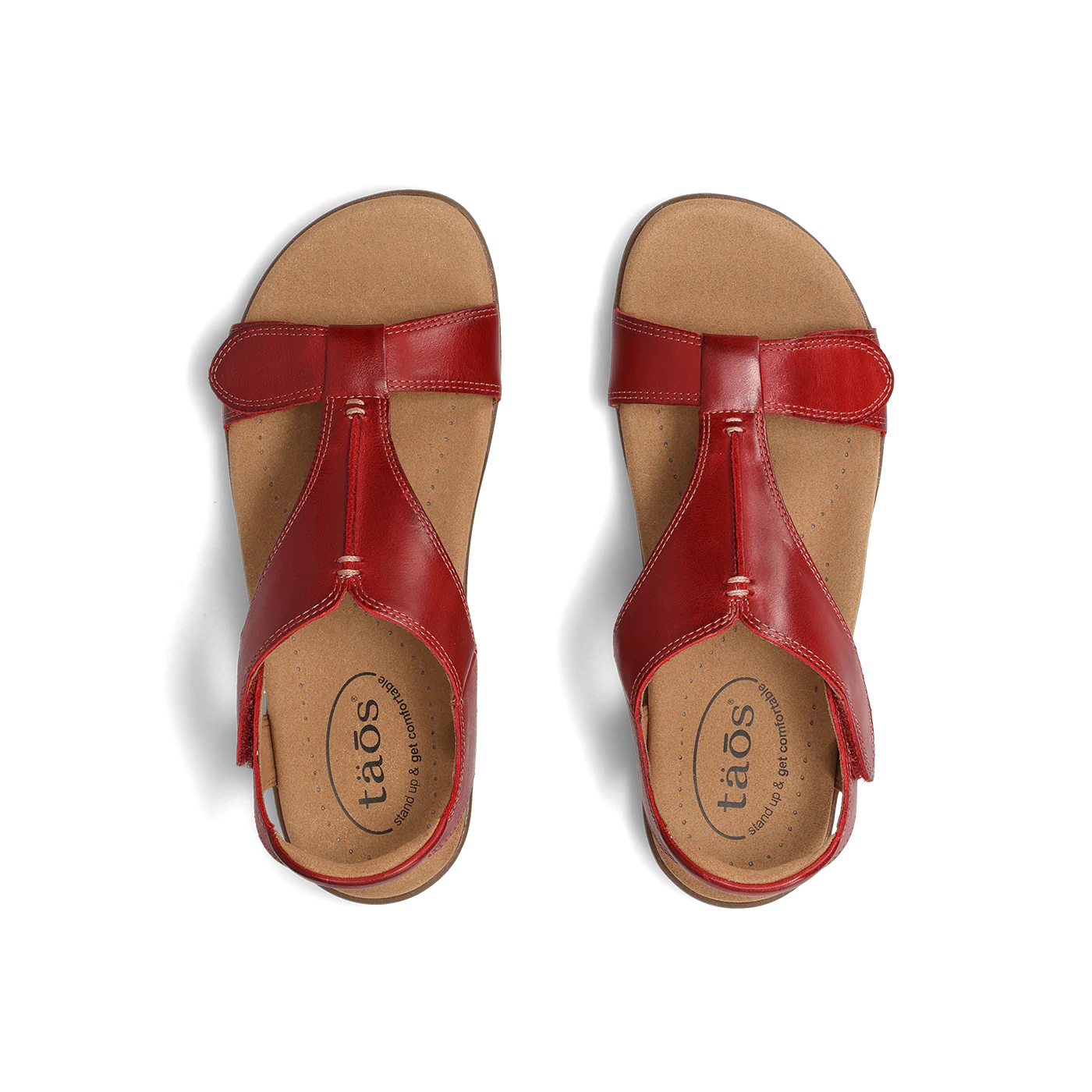 Top view of a pair of red Taos sandals featuring a T-strap design with adjustable straps and a cushioned footbed for comfort.