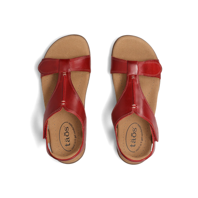 Top view of a pair of red Taos sandals featuring a T-strap design with adjustable straps and a cushioned footbed for comfort.