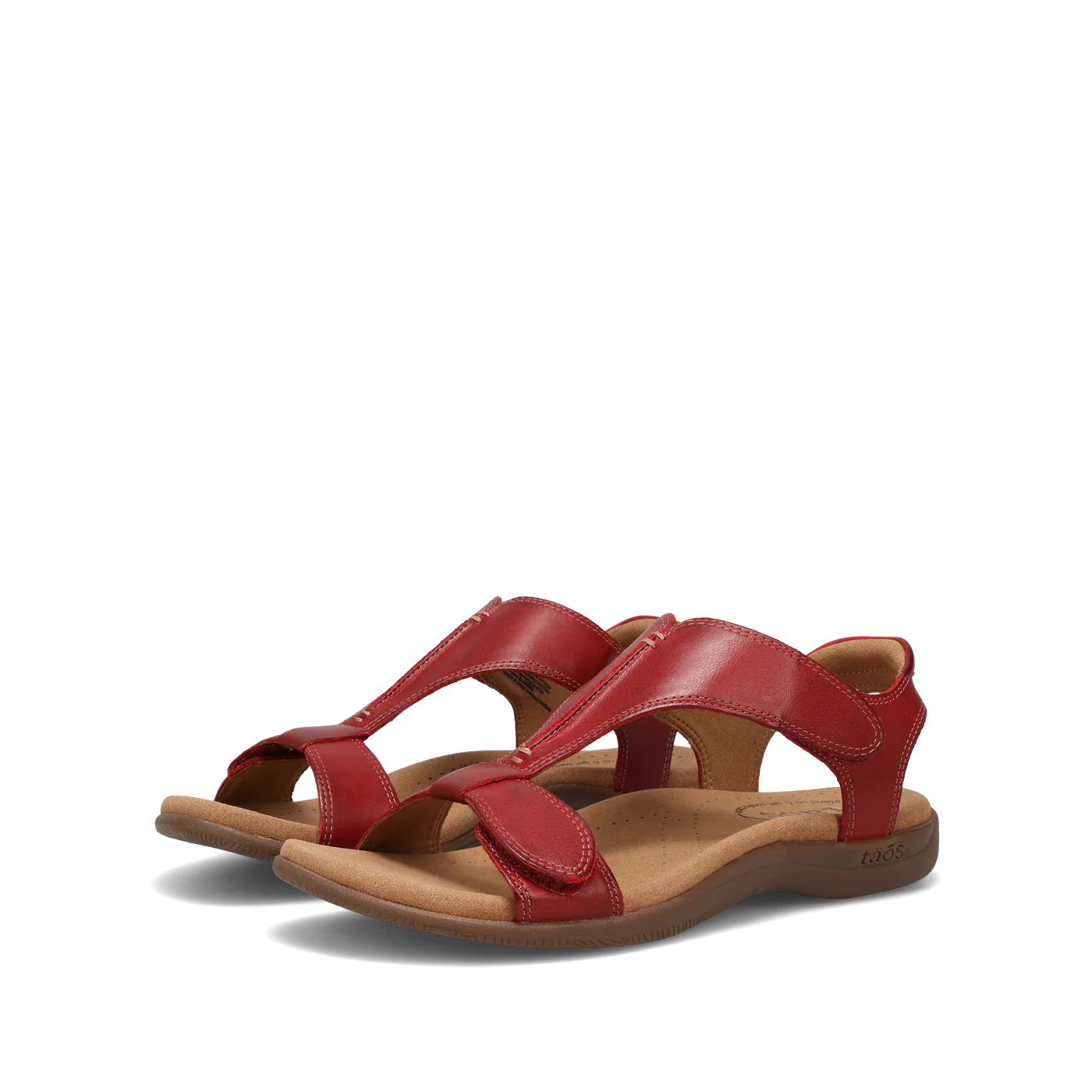 Side view of  a pair of red Taos sandals featuring a T-strap design with adjustable straps and a cushioned footbed for comfort.