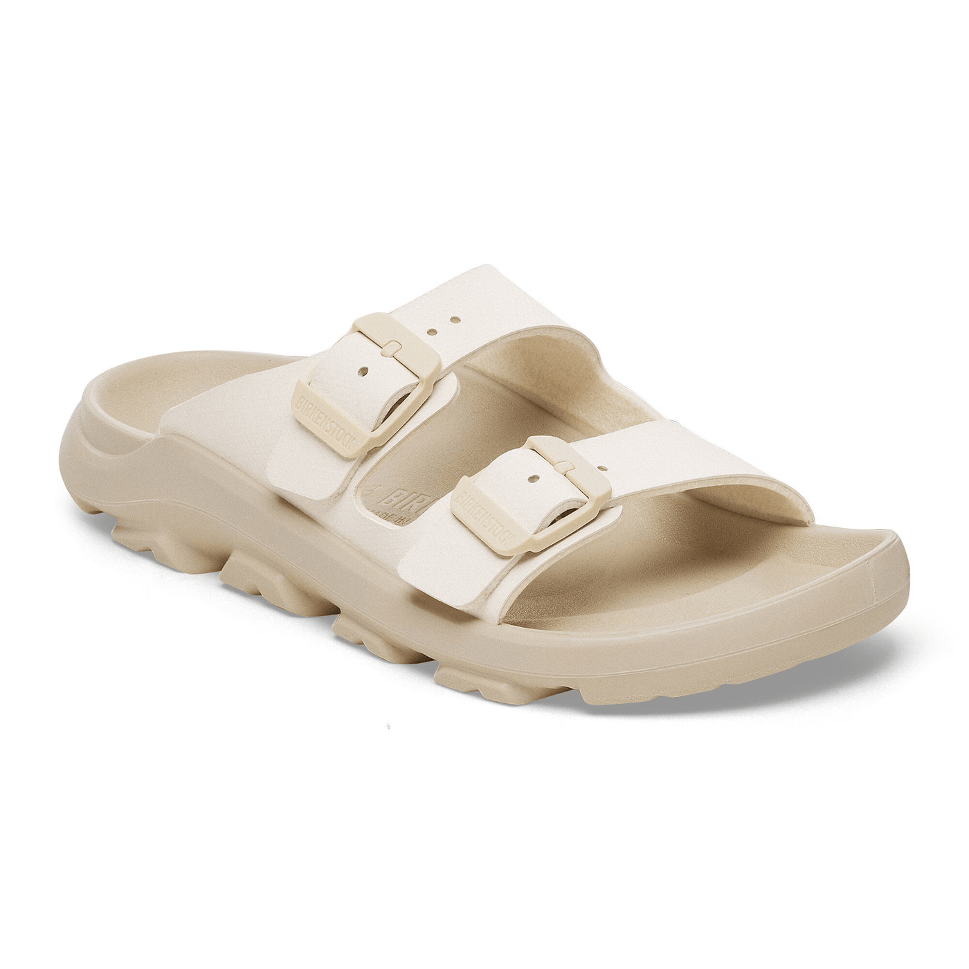 Birkenstock Mogami Terra sandals in beige with rugged tread, stealth buckles, and a water-resistant PU footbed designed for outdoor flexibility, grip, and durability.