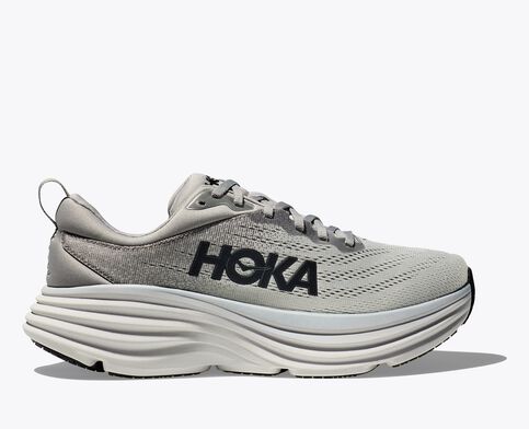 Side view of the HOKA Bondi running shoe in light gray with black branding. Features an ultra-cushioned midsole, extended heel geometry, and billowed rear crash pad for a soft and balanced ride.